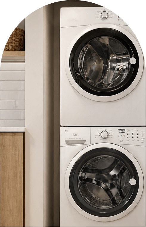 A compact washer and dryer set positioned in a small, functional laundry room.